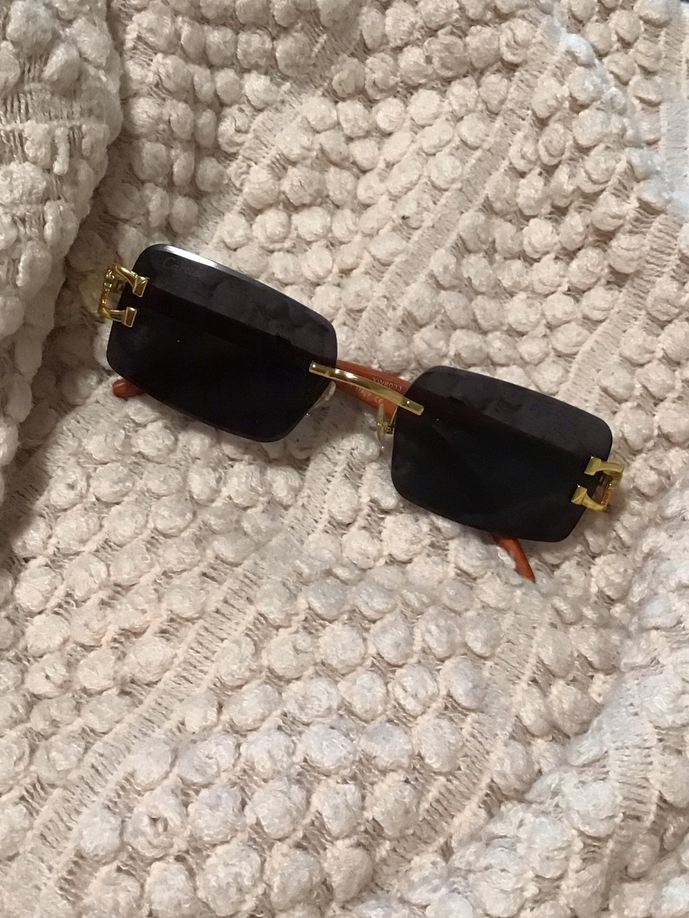 Cartier Rimless Rectangle Sunglasses in Black with Gold Accents